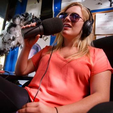 A student doing a radio podcast