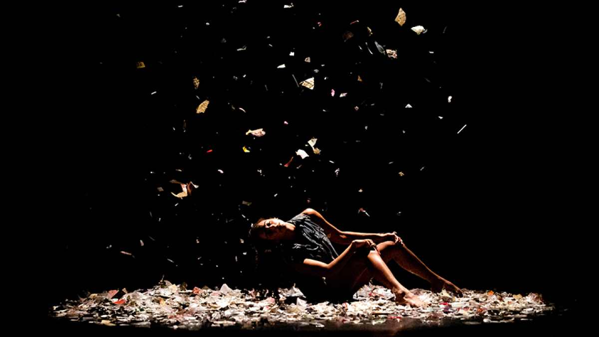 Dancer with confetti falling on stage